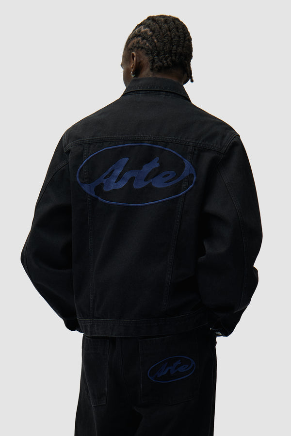 Circle Logo Jeans Jacket in Black worn by a model, half-body back view
