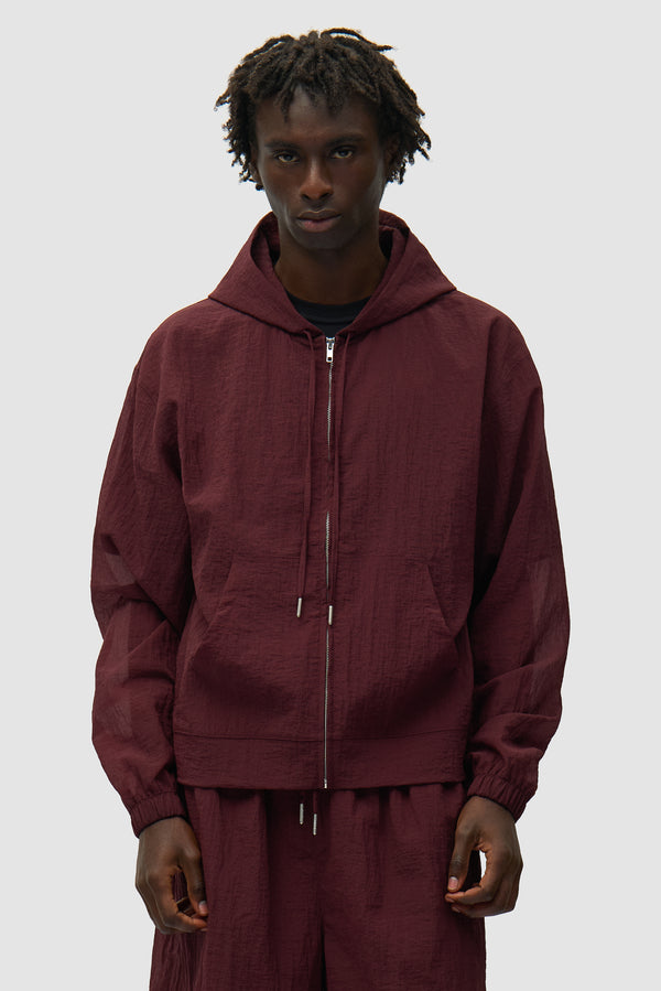 Mesh Jacket in Bordeaux worn by a model, half-body front view