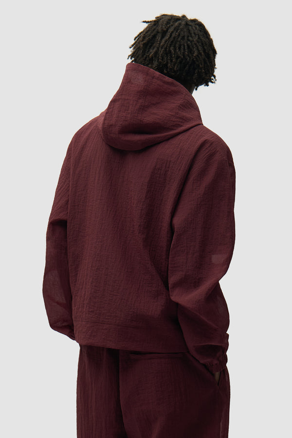 Mesh Jacket in Bordeaux worn by a model, half-body back view