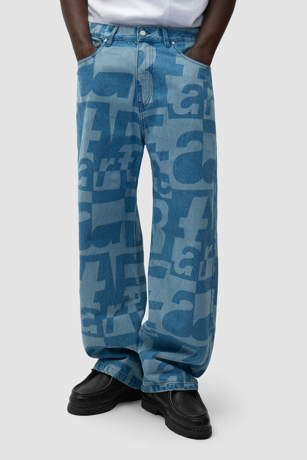 Denim Allover Pants in Raw Denim worn by a model, half-body side view