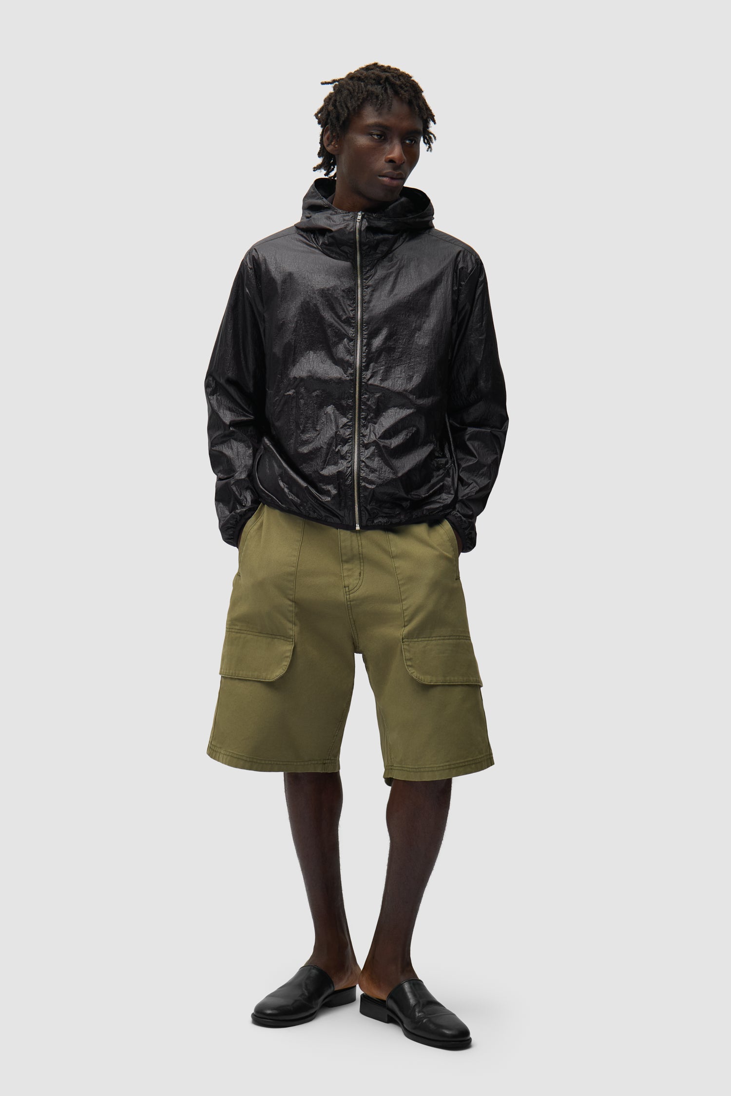 Shiny Nylon Jacket in Black worn by a model, full-body front view