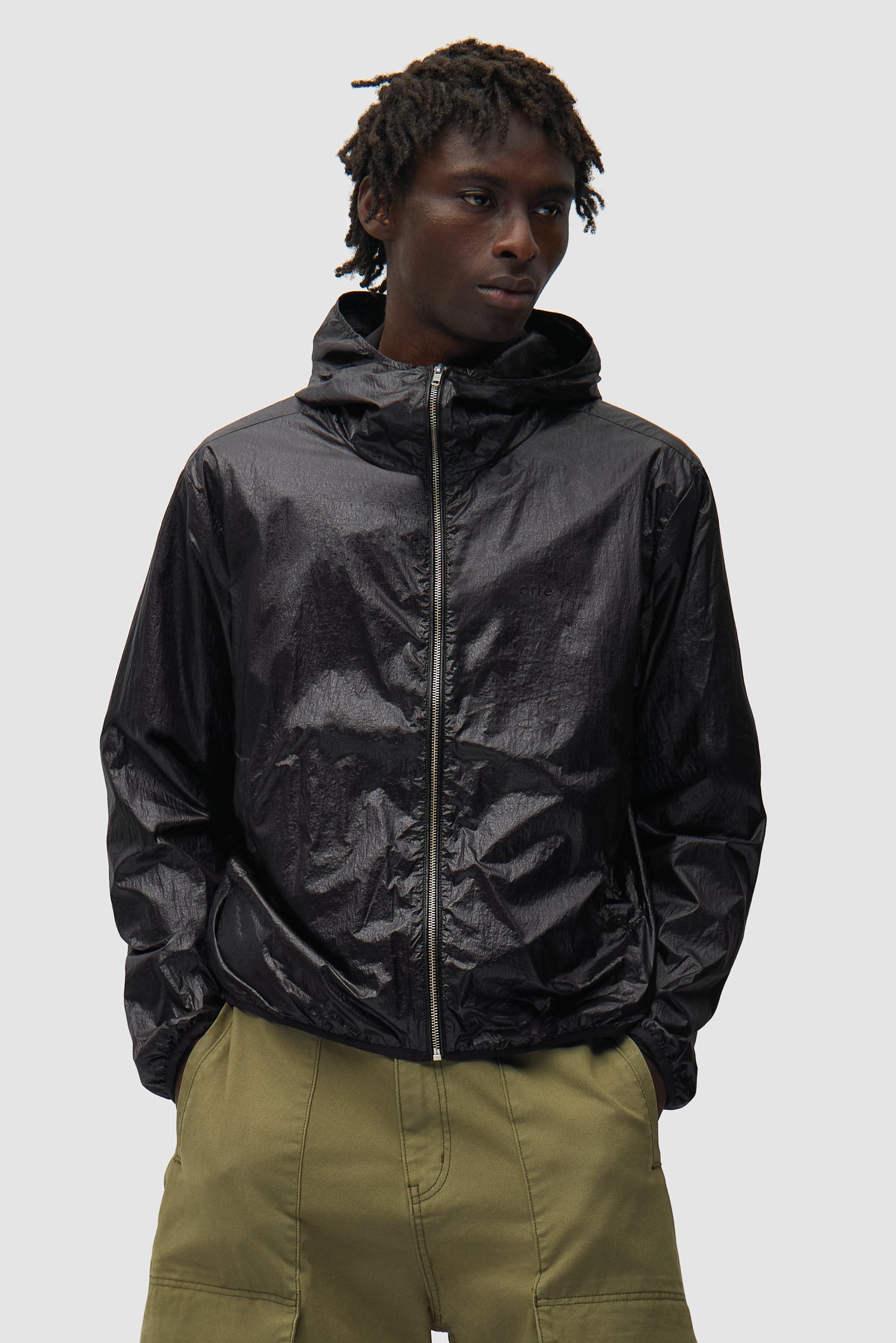Shiny Nylon Jacket in Black worn by a model, half-body front view