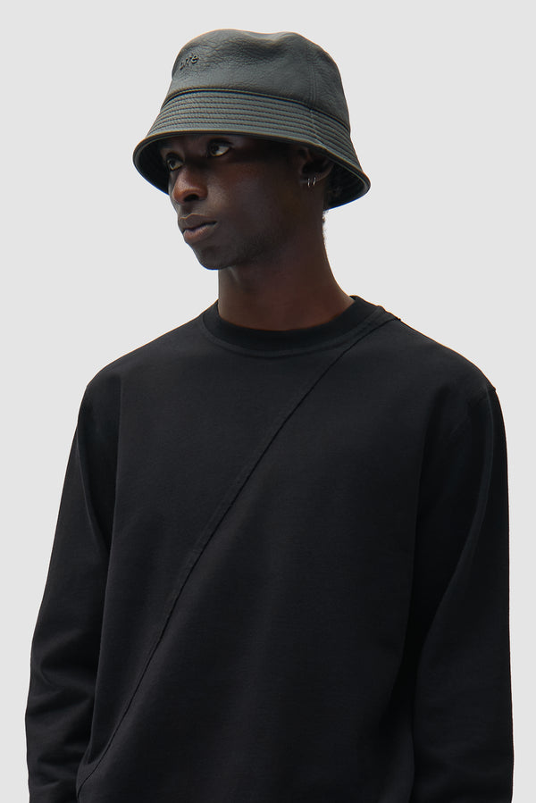 PU Leather Buckethat in Black worn by a model, half-body back view