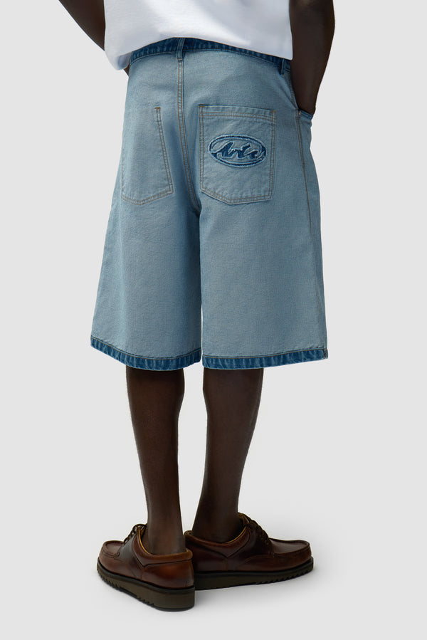 Denim Inside/Out Shorts in Denim Bleach worn by a model, half-body side view