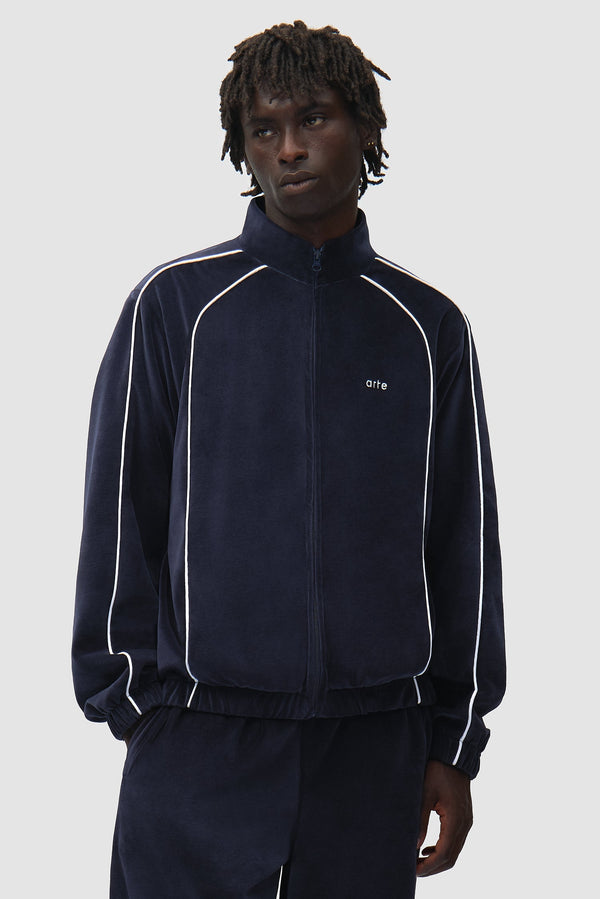Arte x Poatan Track Jacket in Navy worn by a model, half-body front view