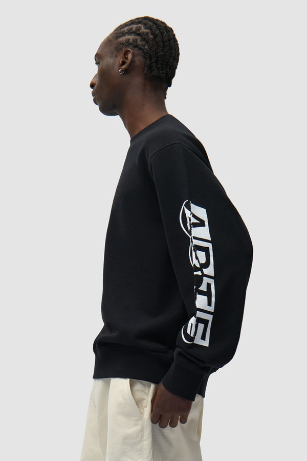 Sleeve Print Crewneck in Black worn by a model, half-body back view