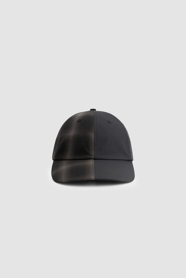 Plaided Nylon Cap in Black/Plaid worn by a model, half-body view